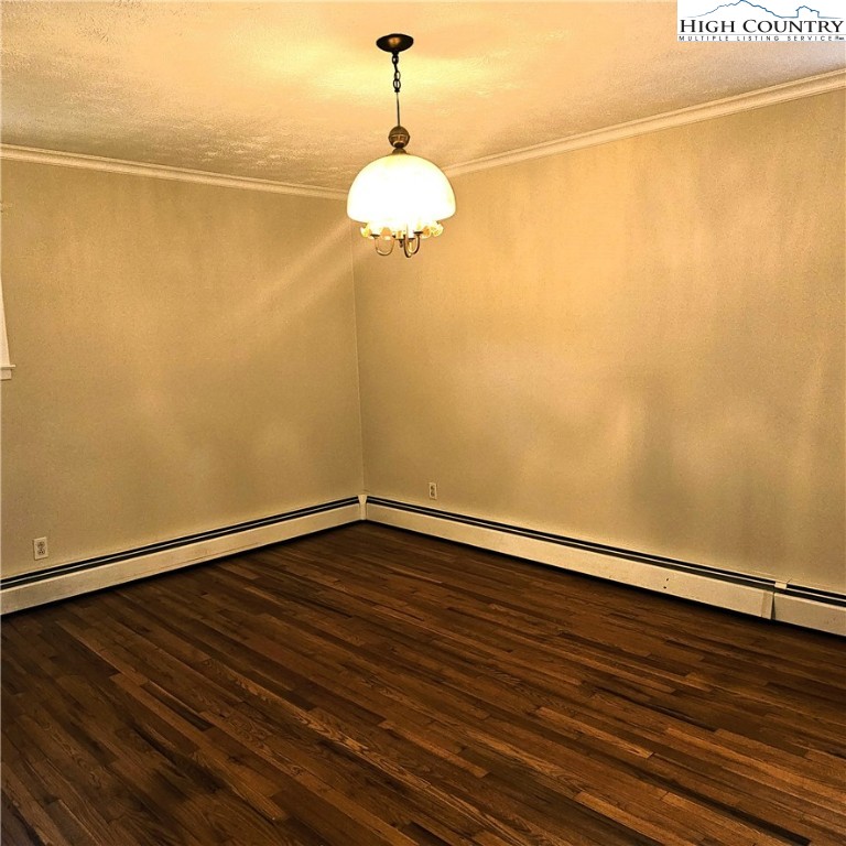 139 Charles Street Boone, NC 28607 - Photo 34 of 49 a view of a room with wooden floor and a ceiling fan