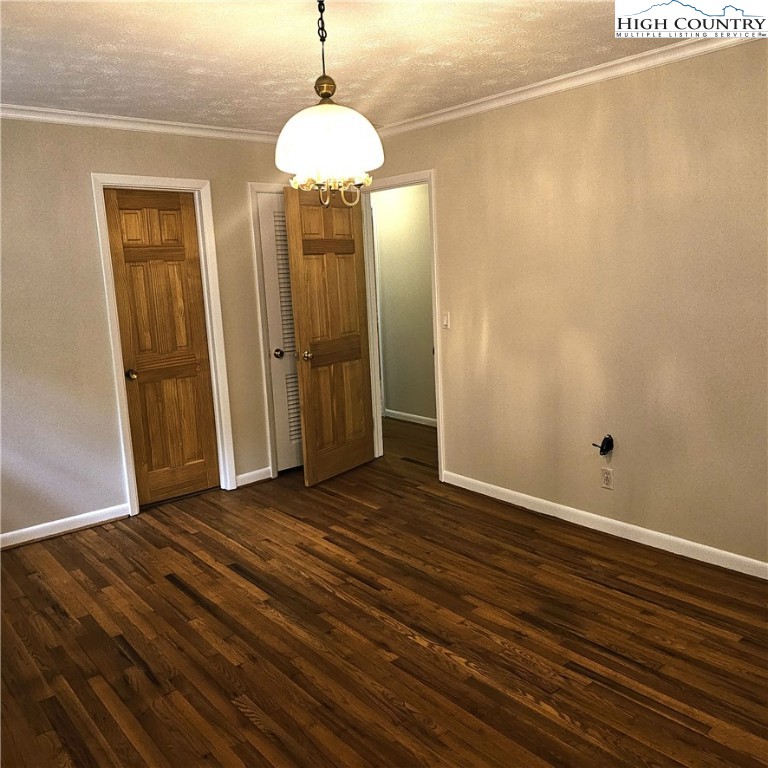 139 Charles Street Boone, NC 28607 - Photo 35 of 49 a view of an empty room with wooden floor and a window