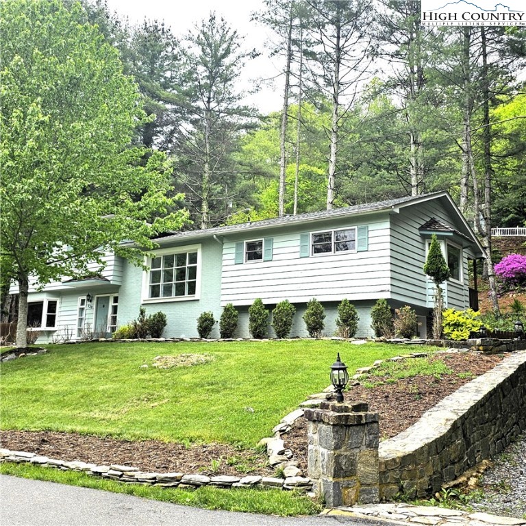 139 Charles Street Boone, NC 28607 - Photo 7 of 49 a front view of a house with a yard