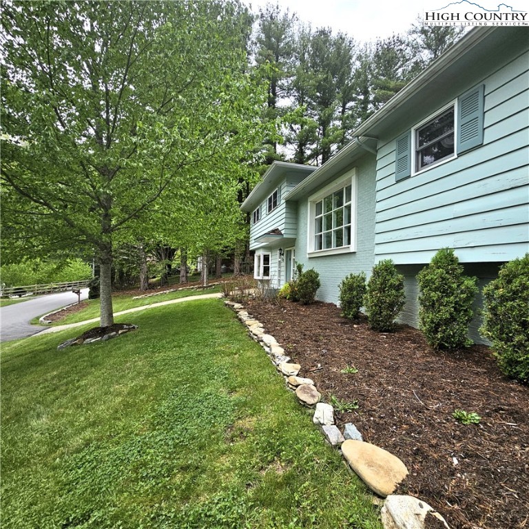 139 Charles Street Boone, NC 28607 - Photo 8 of 49 a backyard of a house with lots of green space