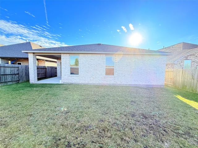 a view of a house with backyard porch and patio