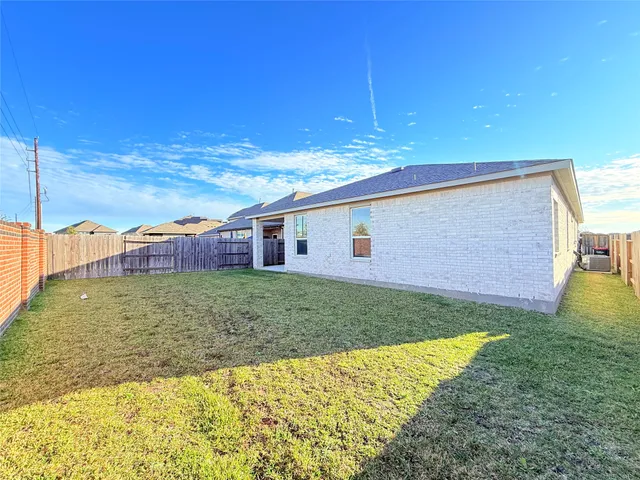 a view of play room with furniture and garden