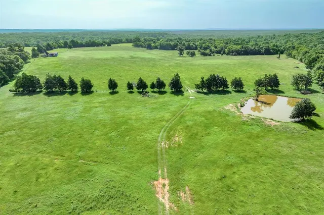 a view of a lake with a yard
