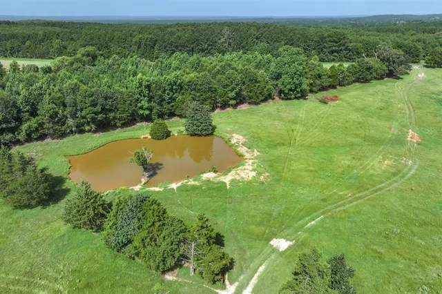 a view of a lake with a yard
