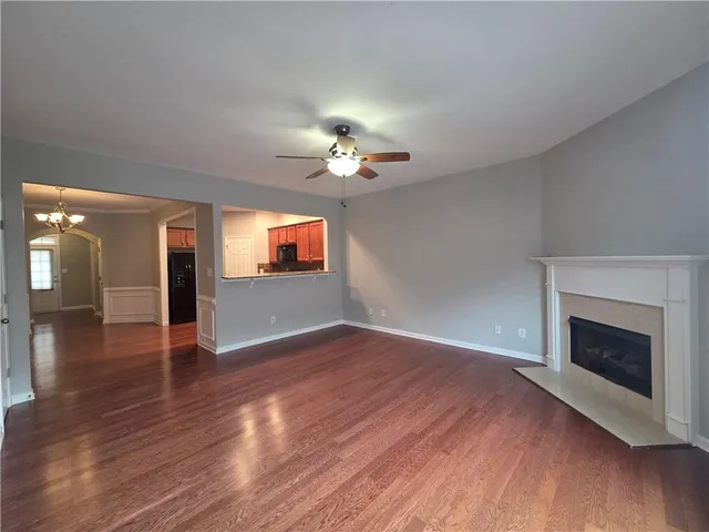 a view of an entryway with wooden floor