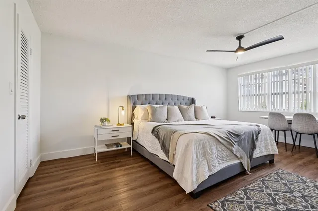 a bedroom with a bed and a table