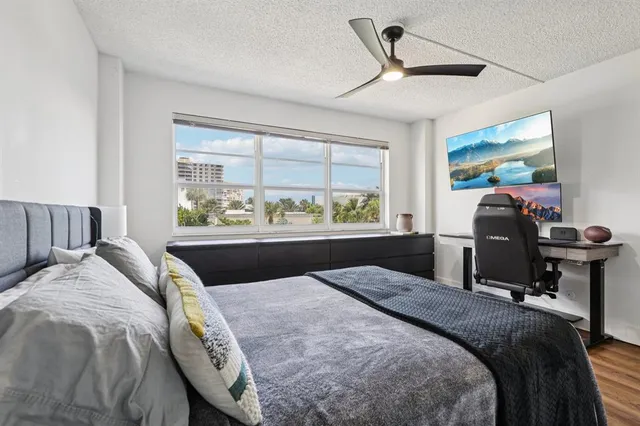 a bed sitting in a bedroom next to a window