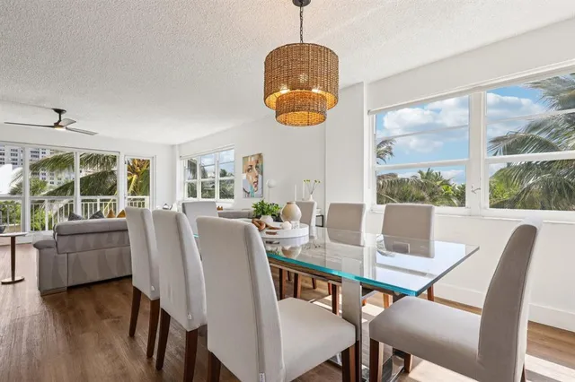 a dining room with furniture window wooden floor