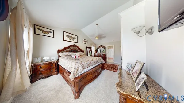 a bedroom with bed and cabinets