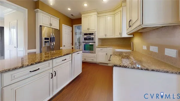 a view of a dining room with furniture and a window