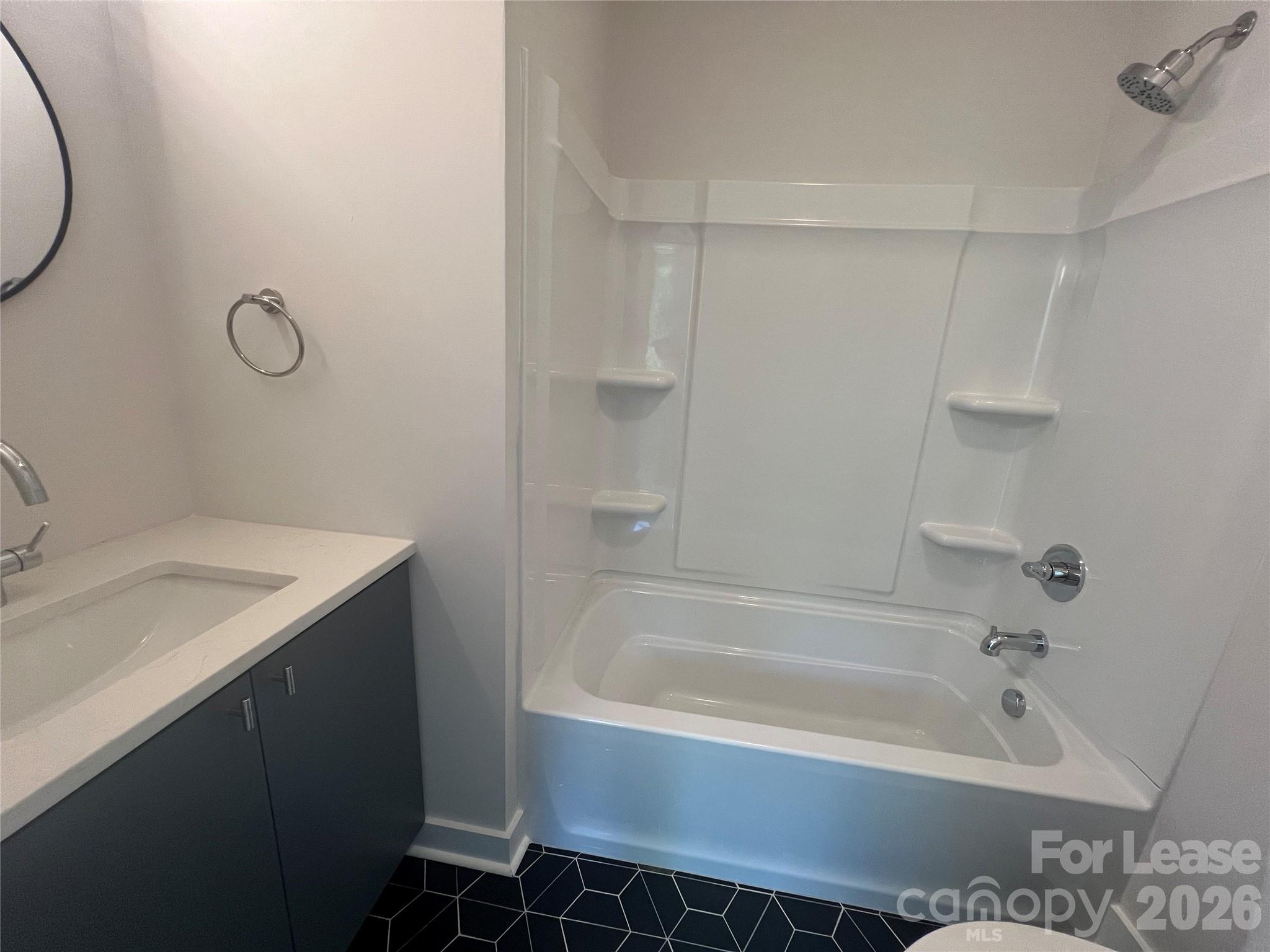 1356 Briar Creek Road Charlotte, NC 28205 - Photo 4 of 15 a bathroom with a granite countertop sink a toilet and bathtub