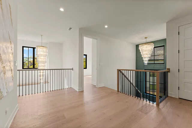 a view of a hallway with windows