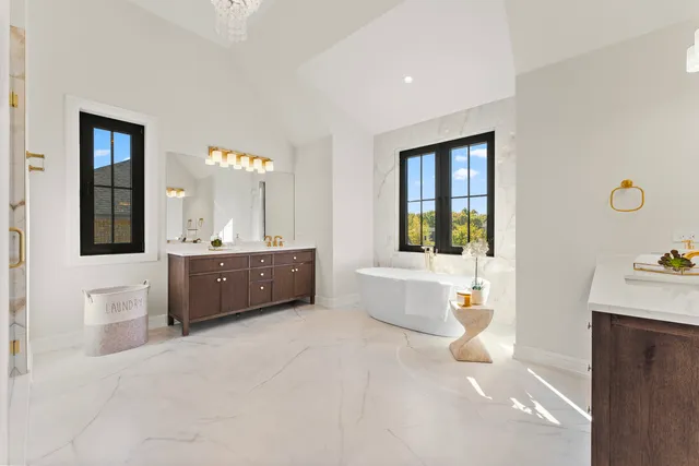 a bathroom with a sink a shower a mirror and a bathtub