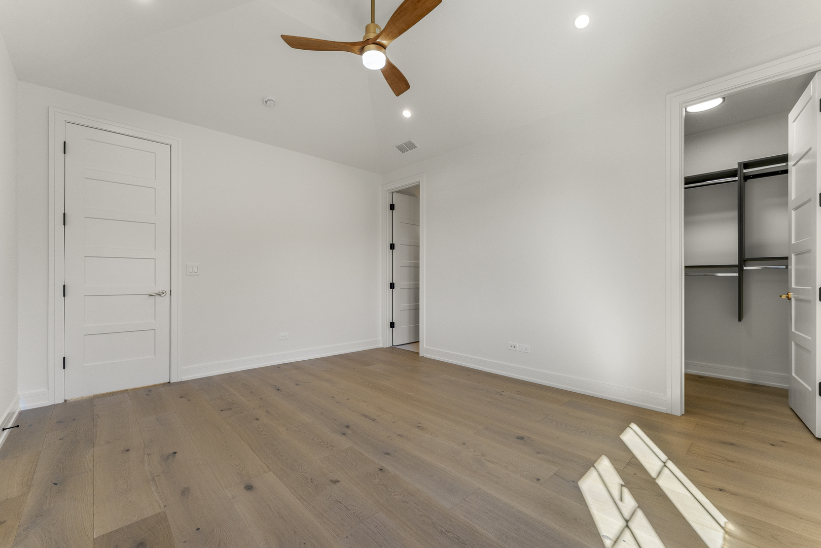 1504 Linden Circle Lemont, IL 60439 - Photo 30 of 54 an empty room with wooden floor cabinet and windows