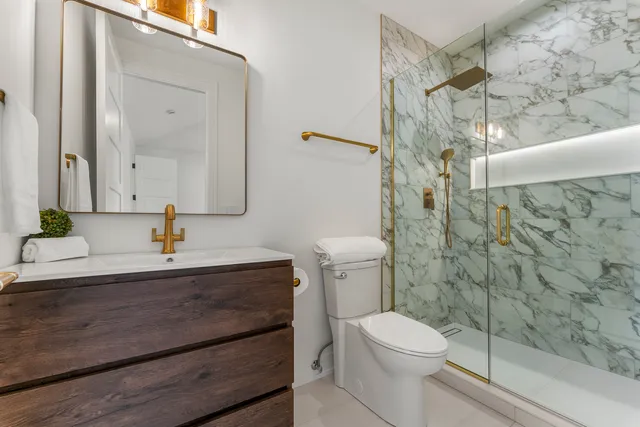 an empty room with windows and ceiling fan