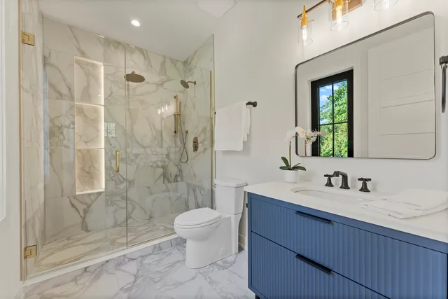 a utility room with sink dryer and washer