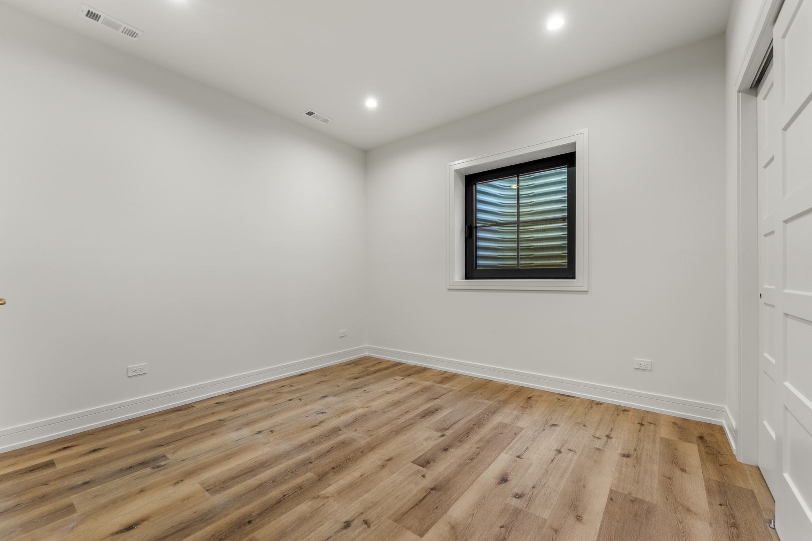 1504 Linden Circle Lemont, IL 60439 - Photo 39 of 54 a view of an empty room with wooden floor and a window
