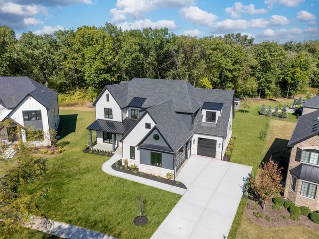 an aerial view of a house with a garden