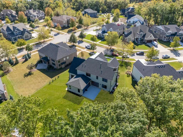 an aerial view of residential houses with outdoor space