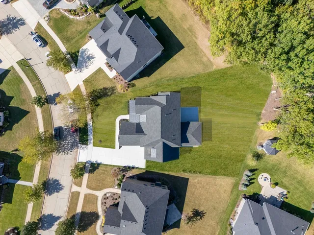 an aerial view of a houses with outdoor space