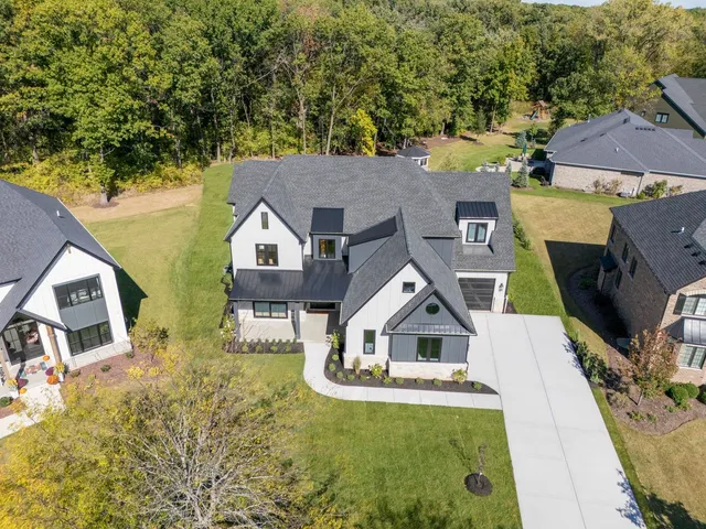 an aerial view of a house with swimming pool
