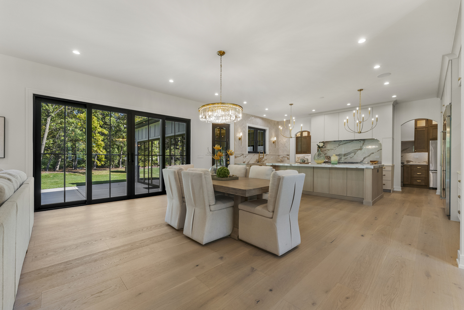 1504 Linden Circle Lemont, IL 60439 - Photo 10 of 54 a living room with stainless steel appliances granite countertop furniture a fireplace a flat screen tv and a large window