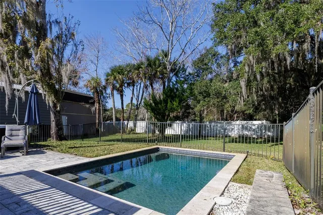 a view of a swimming pool with a patio