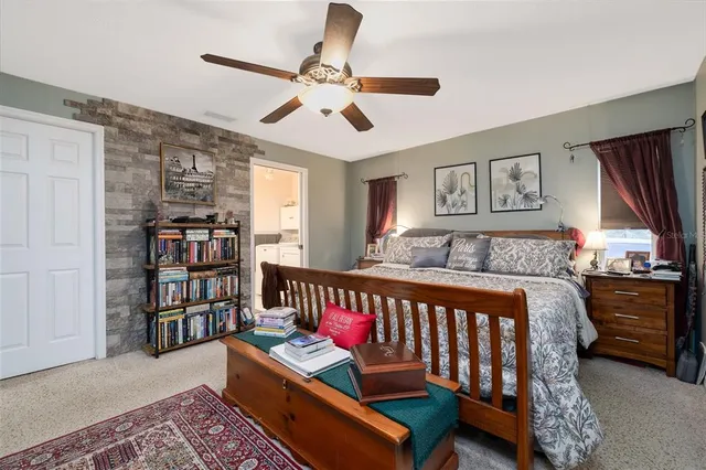 a bedroom with furniture and a window