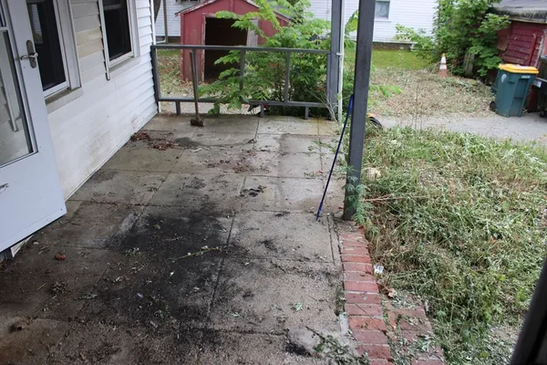 a view of a back yard with porch