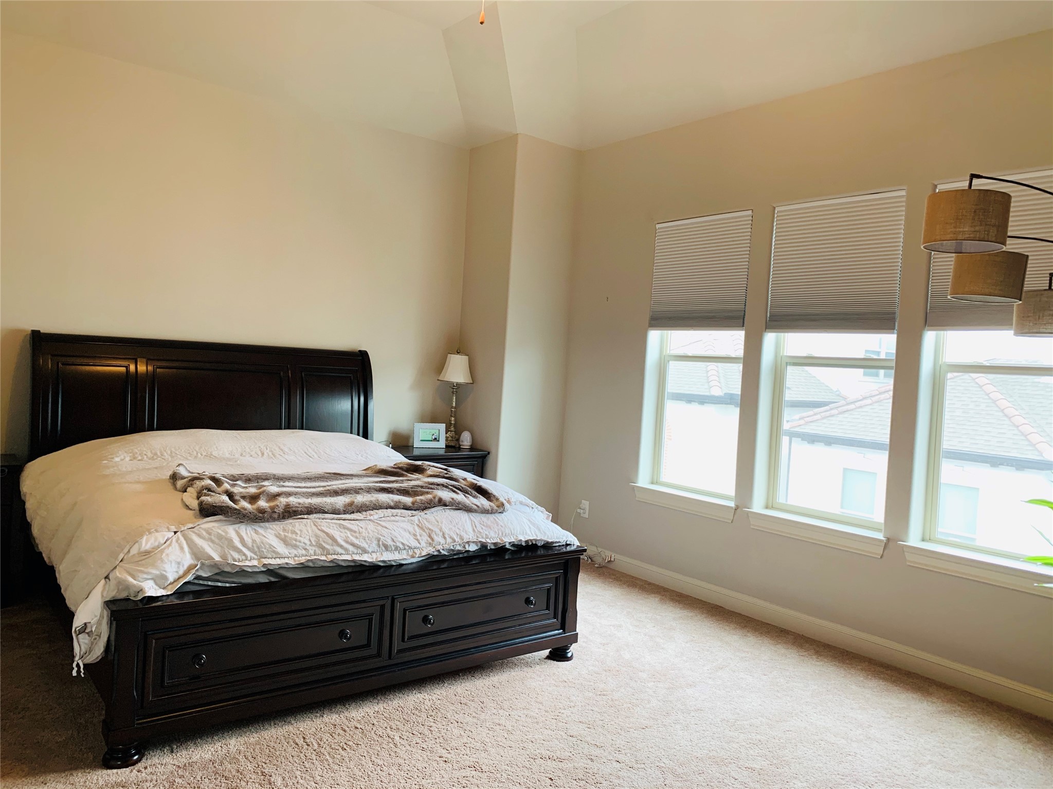 5709 Arabelle Lake Street Houston, TX 77007 - Photo 11 of 20 a bed sitting in a bedroom next to a window