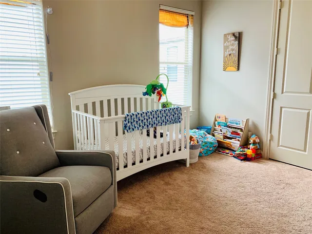 a bedroom with furniture and a window