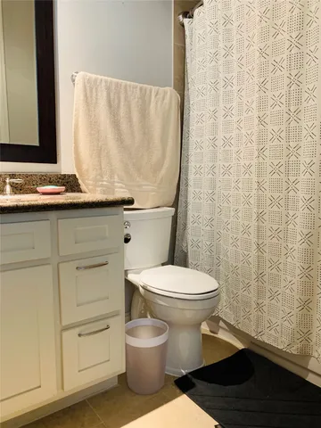 a bathroom with a toilet and a sink