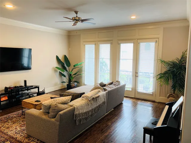 a living room with furniture fireplace and a flat screen tv