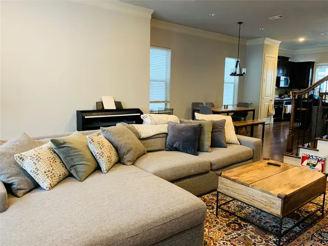 a living room with furniture a rug and a fireplace