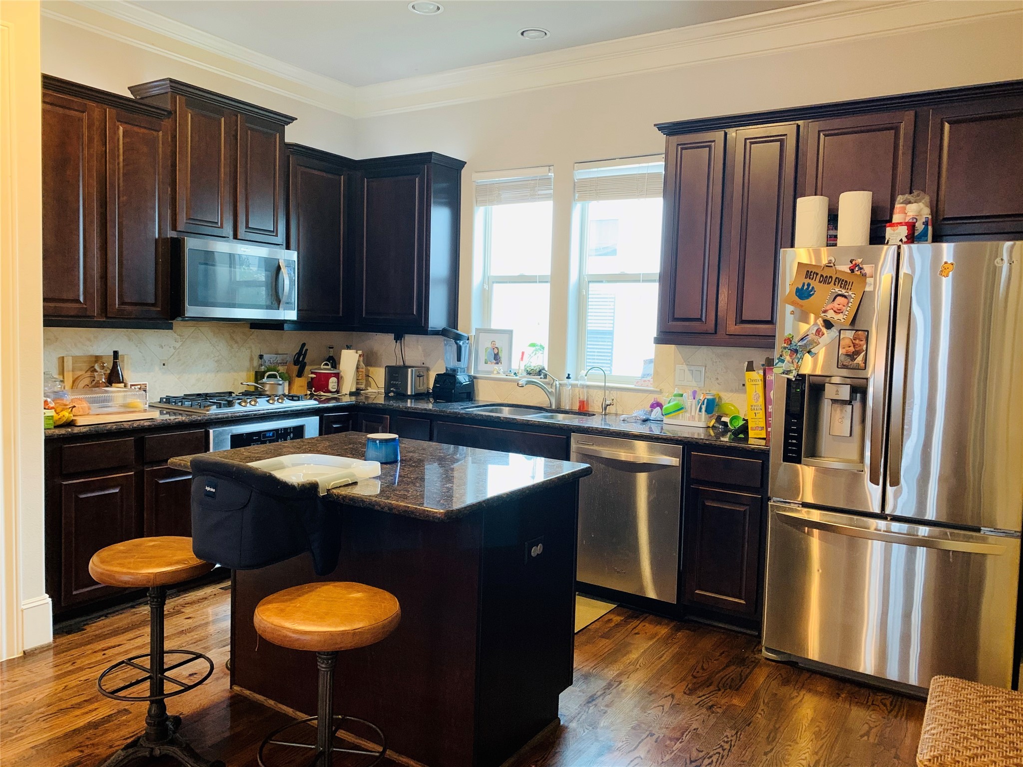 5709 Arabelle Lake Street Houston, TX 77007 - Photo 9 of 20 a kitchen with stainless steel appliances granite countertop a refrigerator a sink a stove a counter space and cabinets