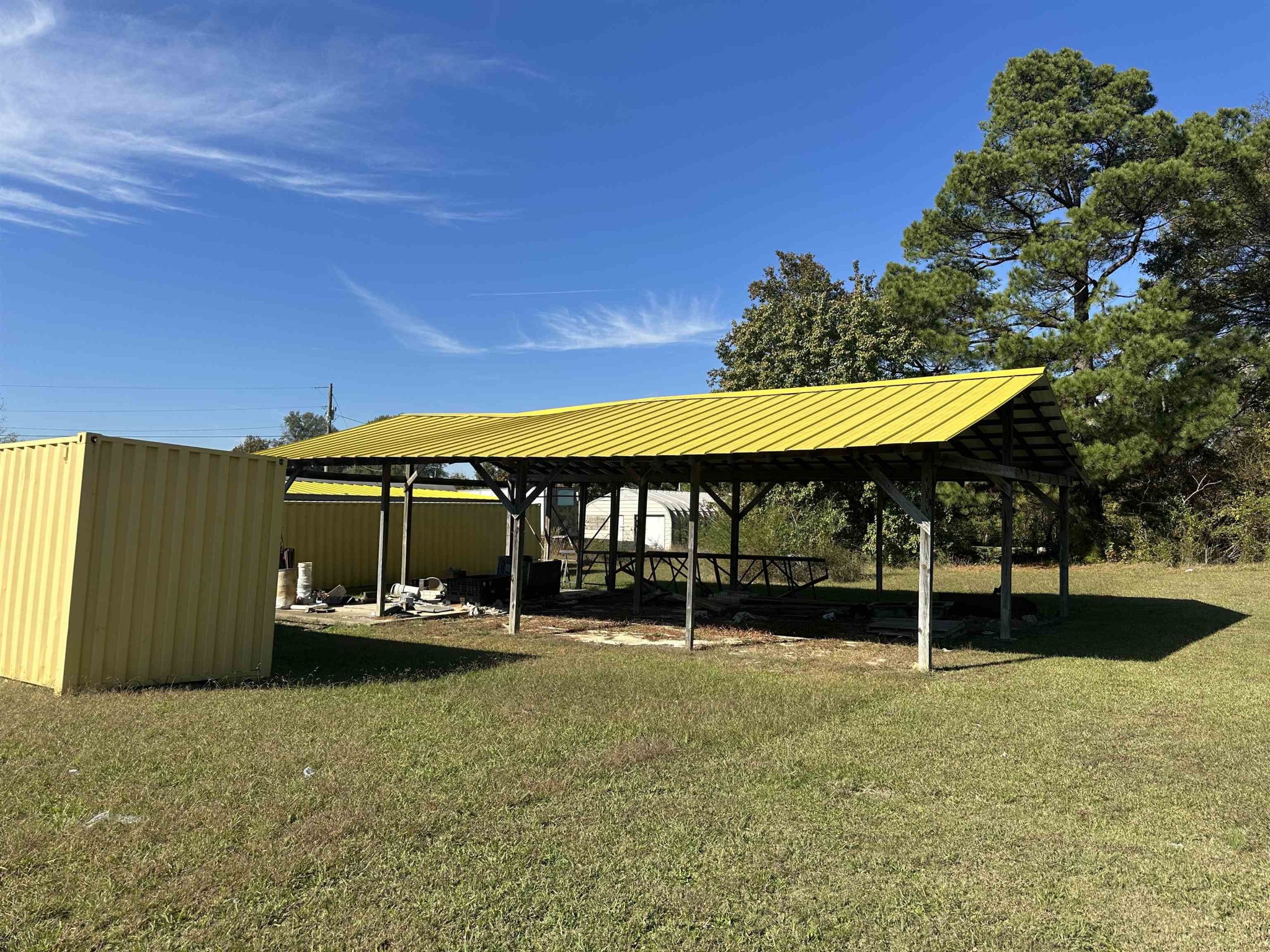 2645 Highway 64 Crump, TN 38310 - Photo 13 of 23 a backyard of a house with barbeque oven table and chairs