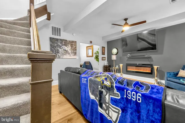 a kitchen with stainless steel appliances a sink a stove a refrigerator cabinets and a counter top space