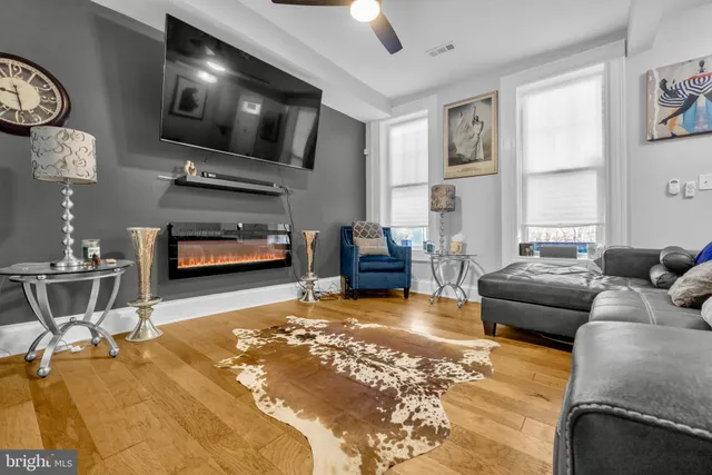 a kitchen with stainless steel appliances a stove microwave and cabinets