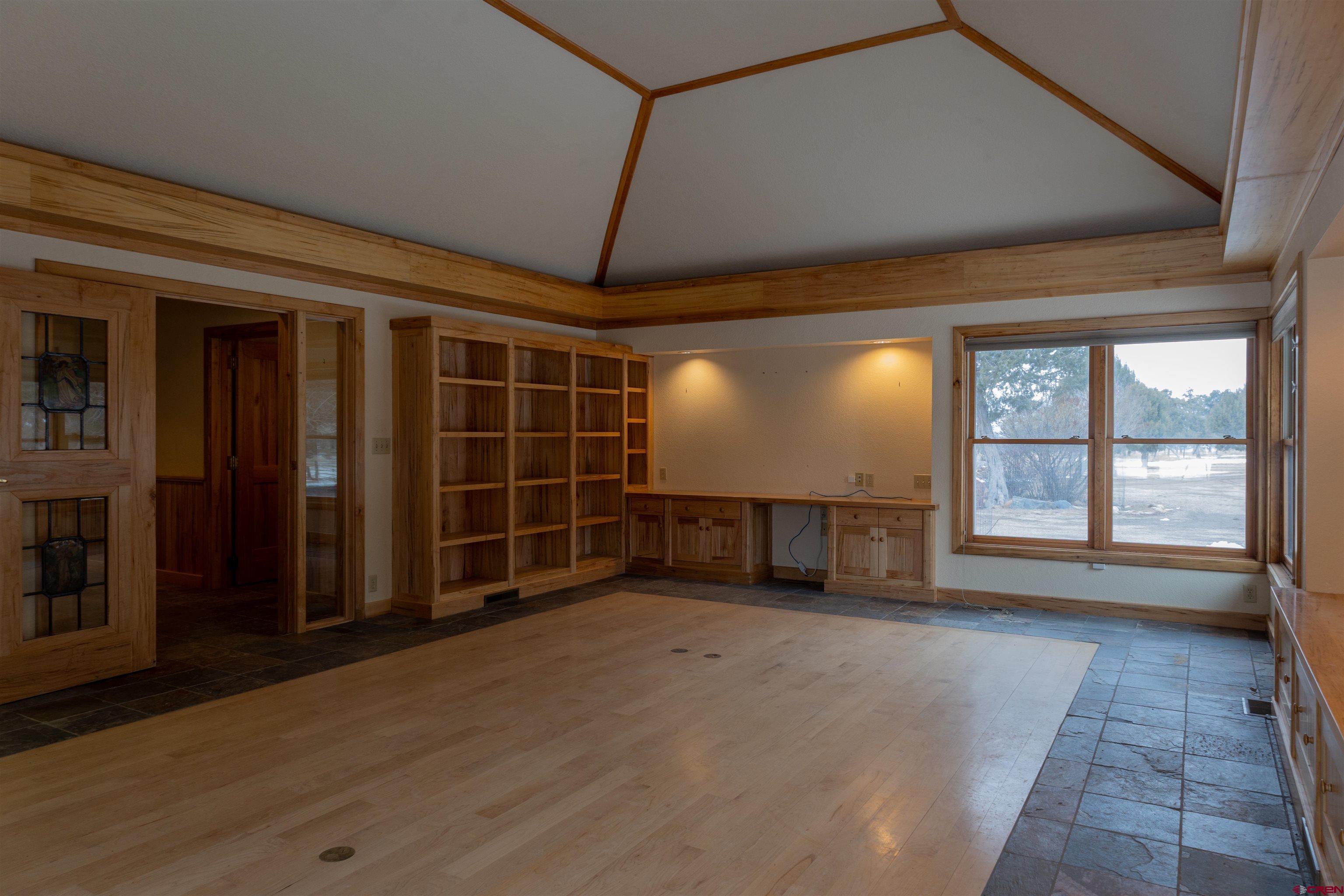 40926 Rd J Mancos, CO 81328 - Photo 6 of 15 a view of an empty room with a fireplace and a window