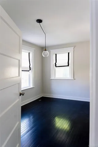 a bathroom with a sink mirror and toilet