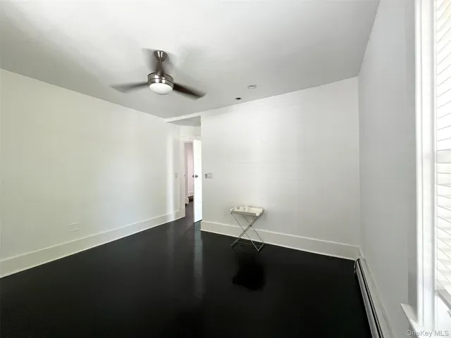 a bathroom with a granite countertop bathtub and a toilet