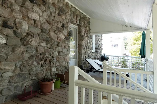 a view of a balcony with chairs