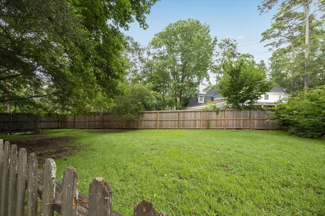 a view of a backyard with a small cabin