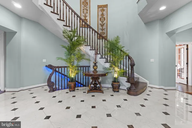 a kitchen with stainless steel appliances granite countertop a sink stove and a refrigerator