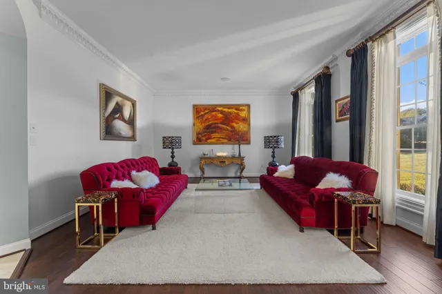 a living room with furniture fireplace and a flat screen tv