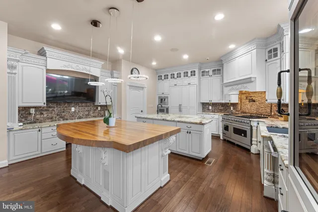 a living room with furniture large window and a table