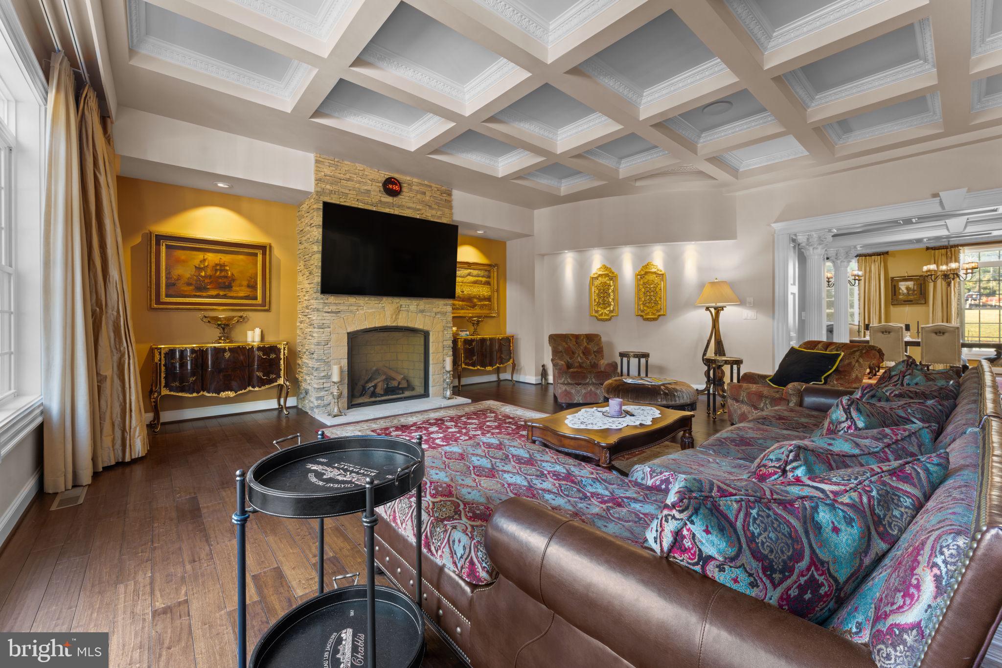 11561 Stuart Mill Road Oakton, VA 22124 - Photo 27 of 76 a living room with furniture fireplace and a flat screen tv