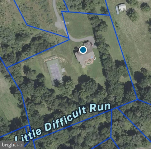 a view of a house with backyard and mountain view