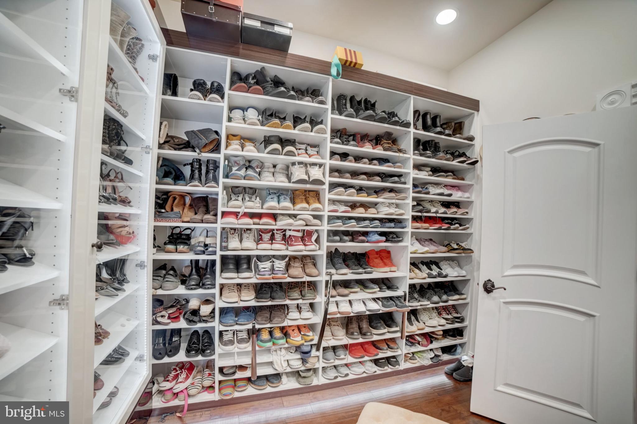 11561 Stuart Mill Road Oakton, VA 22124 - Photo 35 of 76 a view of walk in closet with clothes and shoes