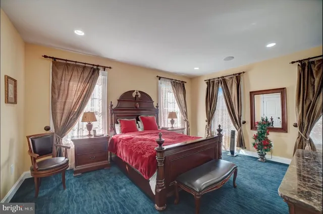 a living room with furniture a flat screen tv and a rug